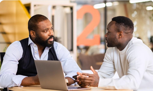 Colleagues communicating at work
